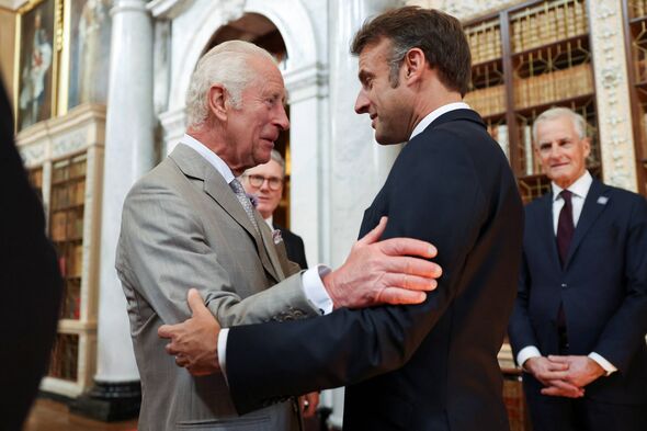 The King with President Macron last year